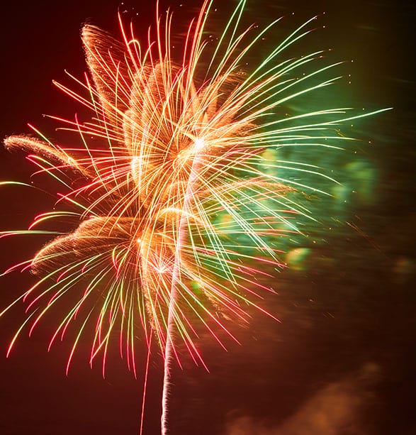 Gold, red and green fireworks lighting up the night sky at a Valley Ranch community celebration
